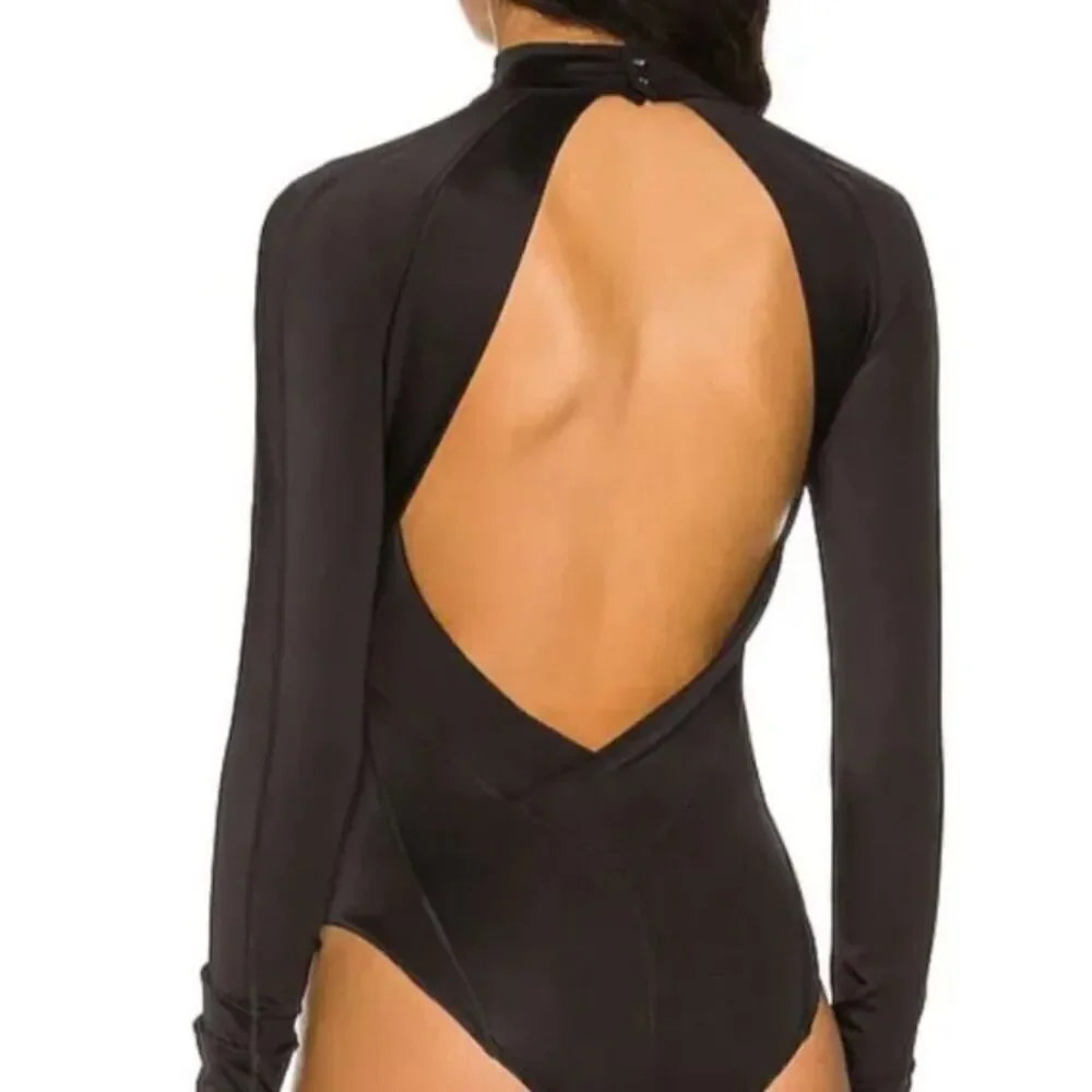 New. We Are HAH black 1-piece swim/bodysuit. Retails $240. Medium
